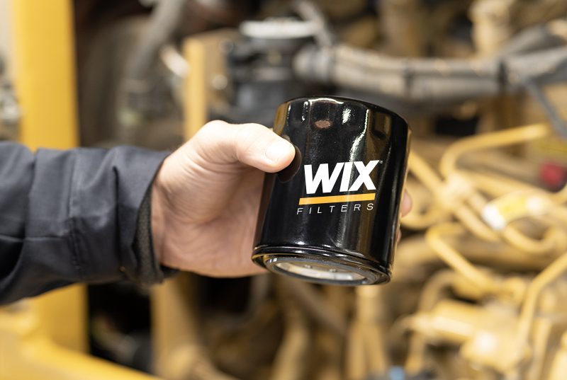 Someone holding a WIX filter